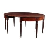 A REGENCY MAHOGANY OVAL DINING TABLE