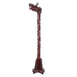A CARVED HARDWOOD DRAGON STAND