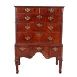 AN 18TH CENTURY FIGURED WALNUT CHEST ON STAND