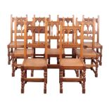 A SET OF TEN OAK HIGH BACK DINING CHAIRS