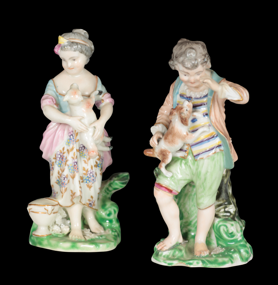 A PAIR OF 18TH CENTURY DUESBURY & CO DERBY PORCELAIN FIGURES - CHILDREN WITH ANIMALS