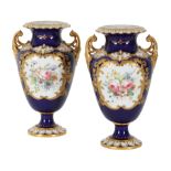 A PAIR OF 1930S ROYAL CROWN DERBY BONE CHINA TWO HANDLED VASES