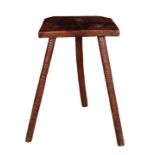 AN EARLY 19TH CENTURY ELM THREE LEGGED STOOL