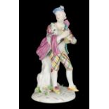 A MID 18TH CENTURY DUESBURY & CO DERBY PORCELAIN FIGURE - A SCOTTISH PIPER