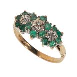 AN EMERALD AND DIAMOND TRIPLE CLUSTER DRESS RING