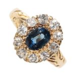 A BLUE TOPAZ AND DIAMOND CLUSTER RING