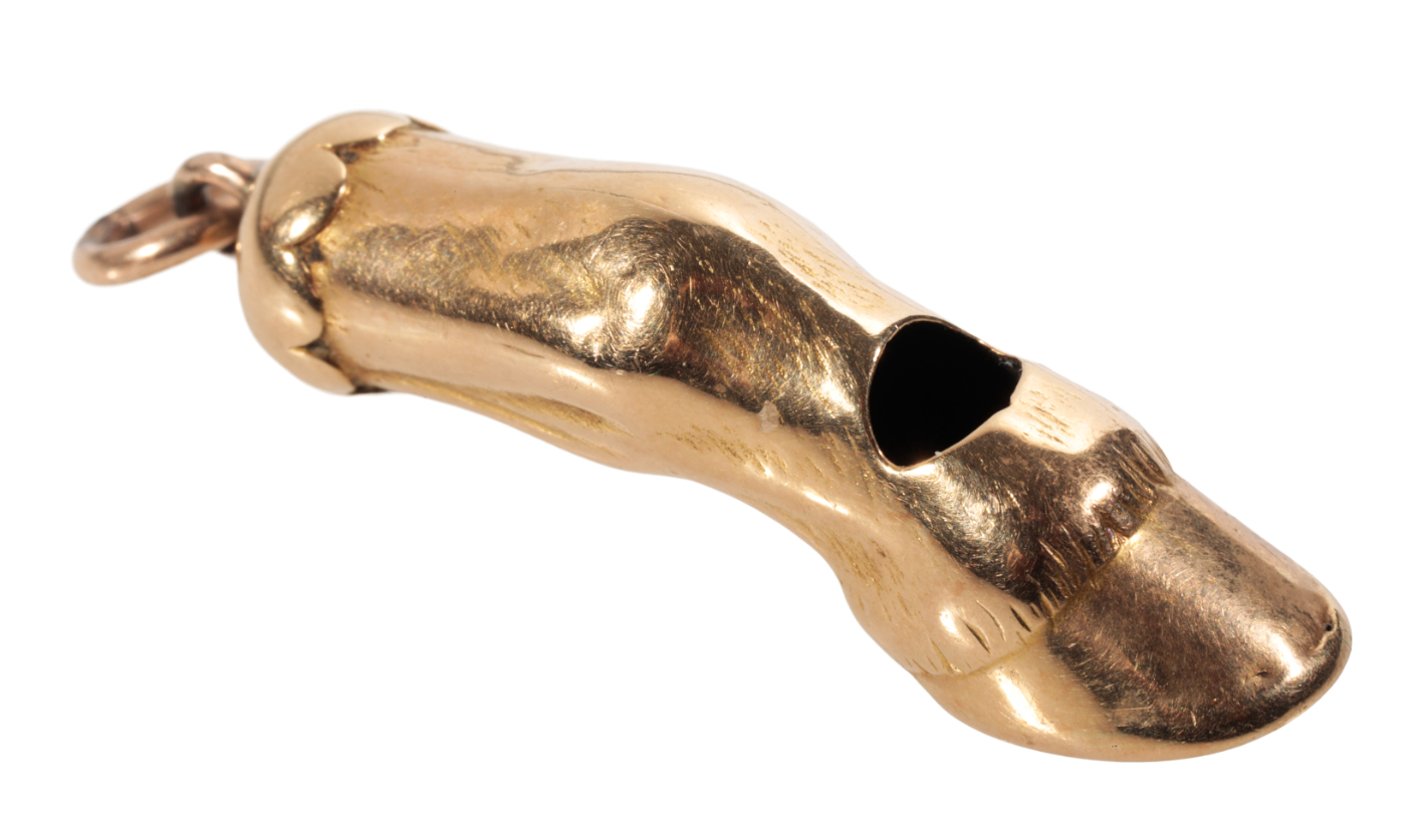 AN UNMARKED YELLOW METAL HORSE HOOF WHISTLE PENDANT