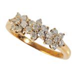 A DIAMOND TRIPLE FLOWERHEAD DRESS RING