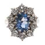 A SAPPHIRE AND DIAMOND CLUSTER RING