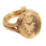 BUECHE-GIROD: AN 18CT GOLD WATCH RING