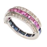 A DIAMOND, RUBY AND SAPPHIRE SWIVEL ETERNITY RING