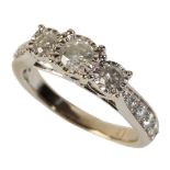 A THREE STONE DIAMOND RING