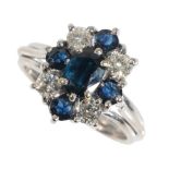 A SAPPHIRE AND DIAMOND CLUSTER RING