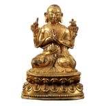 A SINO-TIBETAN GILT BRONZE BUDDHIST MONK