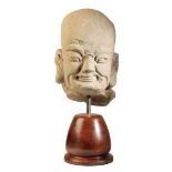 A CHINESE SANDSTONE HEAD OF A LOHAN