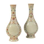 A PAIR OF CHINESE FAMILLE ROSE BOTTLE VASES