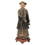 A LARGE CHINESE PAINTED PLASTER â€˜NODDING HEADâ€™ FIGURE