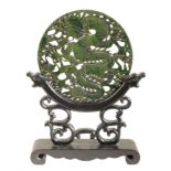 A CHINESE DARK GREEN BOWENITE CIRCULAR PLAQUE