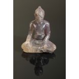 A NEPALESE PINKISH SMOKEY QUARTZ BUDDHA