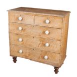 A SCUMBLED PINE CHEST OF DRAWERS