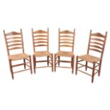 A SET OF FOUR CONTINENTAL LADDER BACK CHAIRS