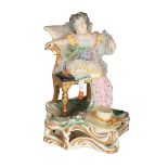 A 19TH CENTURY BLOOR DERBY PORCELAIN FIGURE OF A CHILD IN AN ARMCHAIR