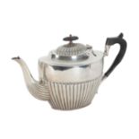 A LATE VICTORIAN SILVER TEAPOT