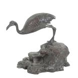 A BRONZE MODEL OF A FLAMINGO