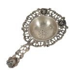 A DUTCH SILVER TEA STRAINER