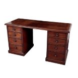 AN EARLY VICTORIAN MAHOGANY KNEEHOLE DESK