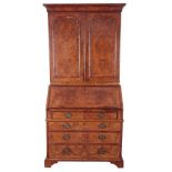 A GEORGE I WALNUT BUREAU-BOOKCASE