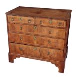 A GEORGE II YEW VENEERED CHEST OF DRAWERS