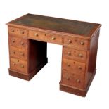 A VICTORIAN OAK KNEEHOLE DESK