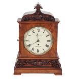 A VICTORIAN WALNUT MANTLE CLOCK