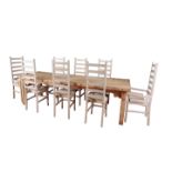 A PALE OAK DINING TABLE