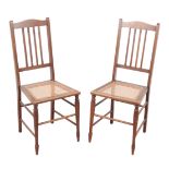 A PAIR OF EDWARDIAN OAK BEDROOM CHAIRS OF ARTS & CRAFTS DESIGN
