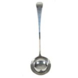 A GEORGE III WHITE METAL OLD ENGLISH PATTERN SOUP LADLE