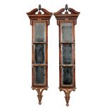 A PAIR OF GEORGE II STYLE MAHOGANY, PARCEL-GILT AND MIRROR-BACK WALL SHELVES