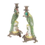 A PAIR OF PORCELAIN AND GILT METAL MOUNTED CANDLESTICKS