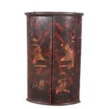 A GEORGE III PAINTED HANGING CORNER CUPBOARD