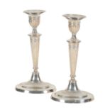 A PAIR OF LATE VICTORIAN SILVER CANDLESTICKS IN NEO-CLASSICAL STYLE