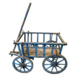 A RUSTIC BLUE-PAINTED LOG CART