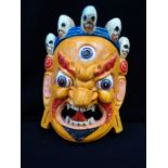 A YELLOW TIBETAN MASK