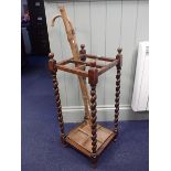 A 1920S OAK BARLEY-TWIST STICK STAND