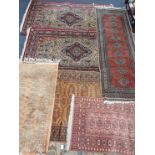 A COLLECTION OF SMALL RUGS AND A RUNNER