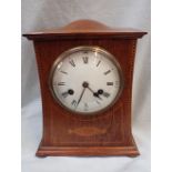 AN EDWARDIAN OAK-CASED AND INLAID MANTEL CLOCK