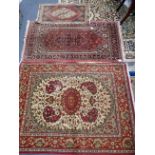 A RED GROUND PERSIAN RUG