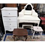 A LAURA ASHLEY FOUR-DRAWER CHEST, A SIMILAR DRESSING TABLE