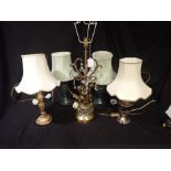 A GILT METAL AND CUT-GLASS TABLE LAMP