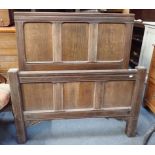 A 17TH CENTURY STYLE PANELLED OAK SINGLE BEDSTEAD